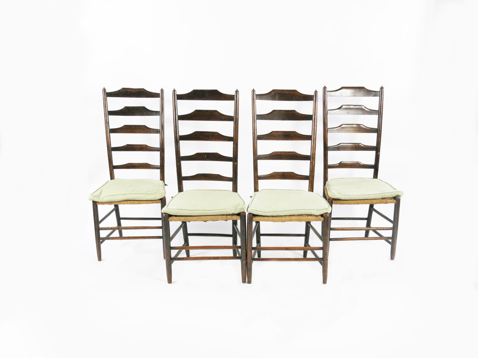 A set of six Clissett High Back ladder-back chairs designed by Ernest Gimson, with strung seats,