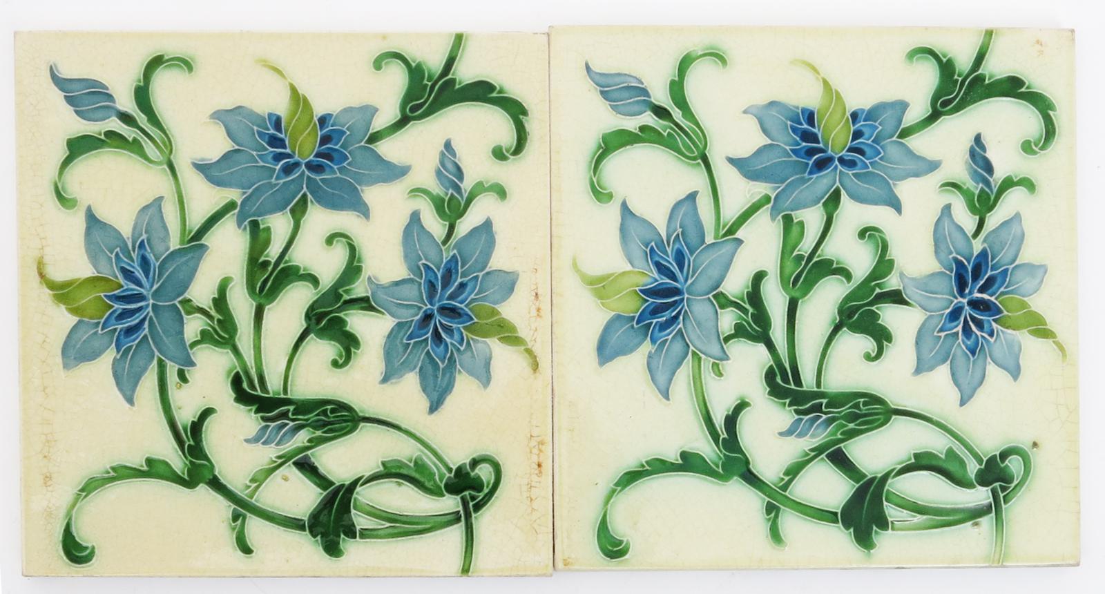 A pair of Pilkington`s tiles designed by Lewis F Day, dust pressed with a flower spray in shades