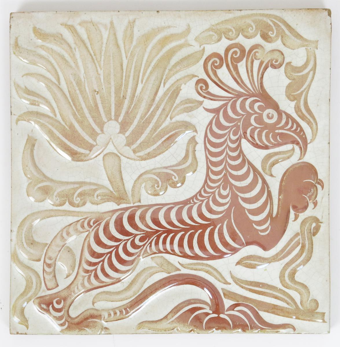 A William De Morgan Sands End Pottery tile designed by Halsey Ricardo, modelled in low relief with a