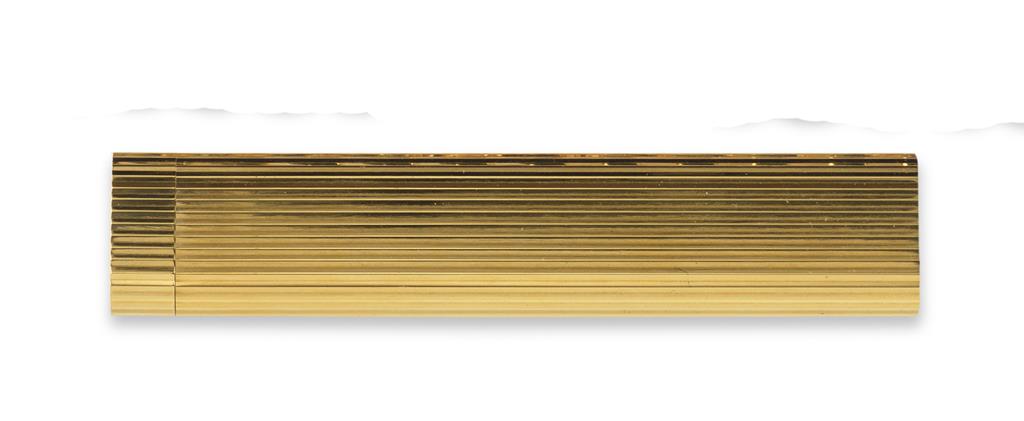 A gold plated table lighter by Cartier, signed Cartier Paris to the base and numbered G69486. Fluted