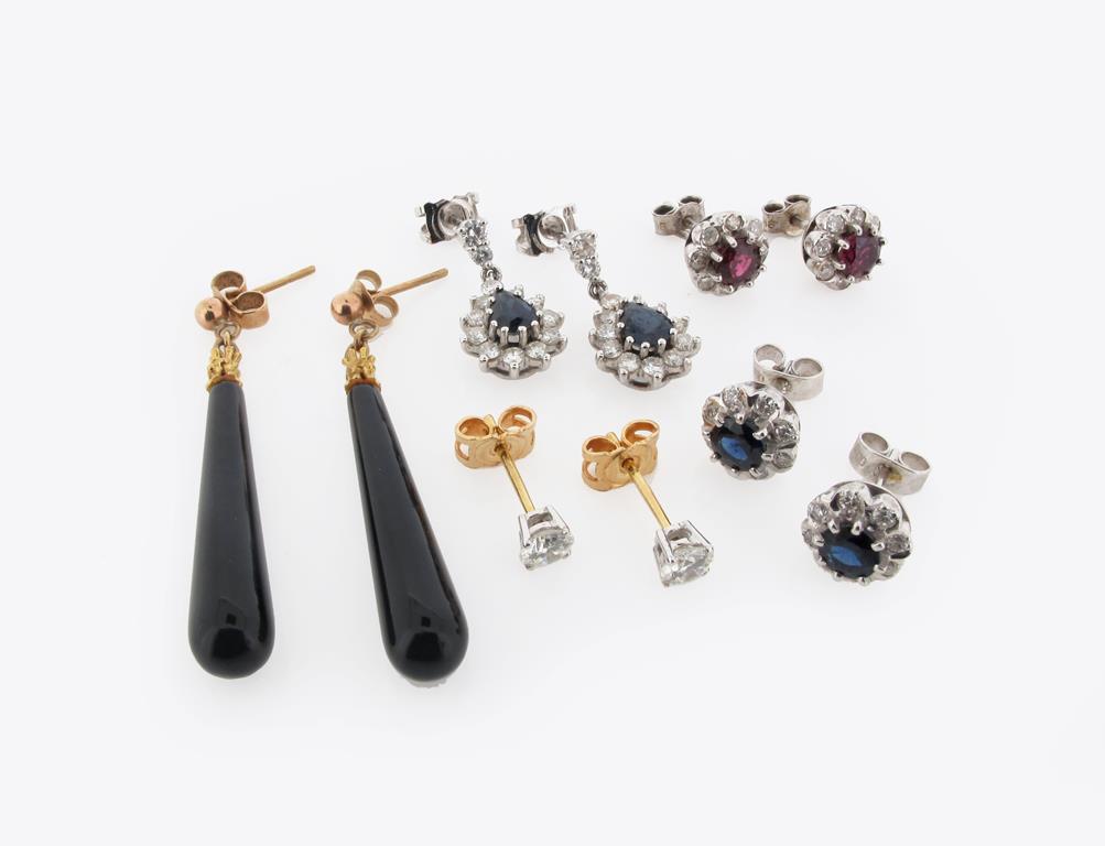 A pair of diamond stud earrings, a pair of sapphire and diamond pear shaped drop earrings, a pair of