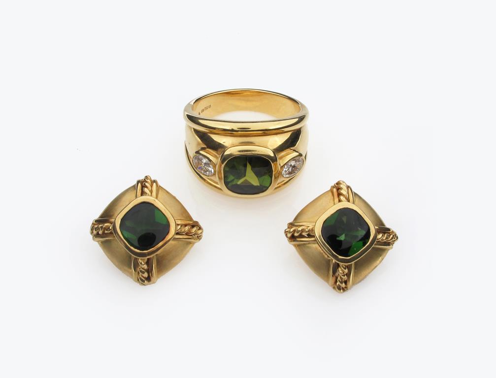 A bombé shaped tourmaline and diamond set gold ring, the square shaped tourmaline set either side