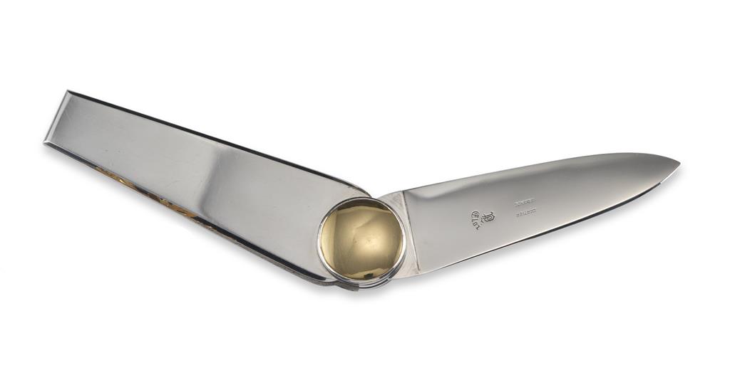 A gold and steel penknife by Cartier, the gold discs rotate to reveal the steel blade signed