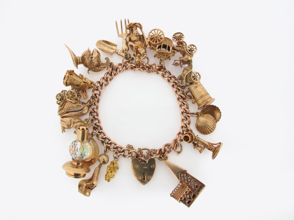 A gold charm bracelet, the 9ct gold curb link bracelet mounted with assorted gold charms. 77g in
