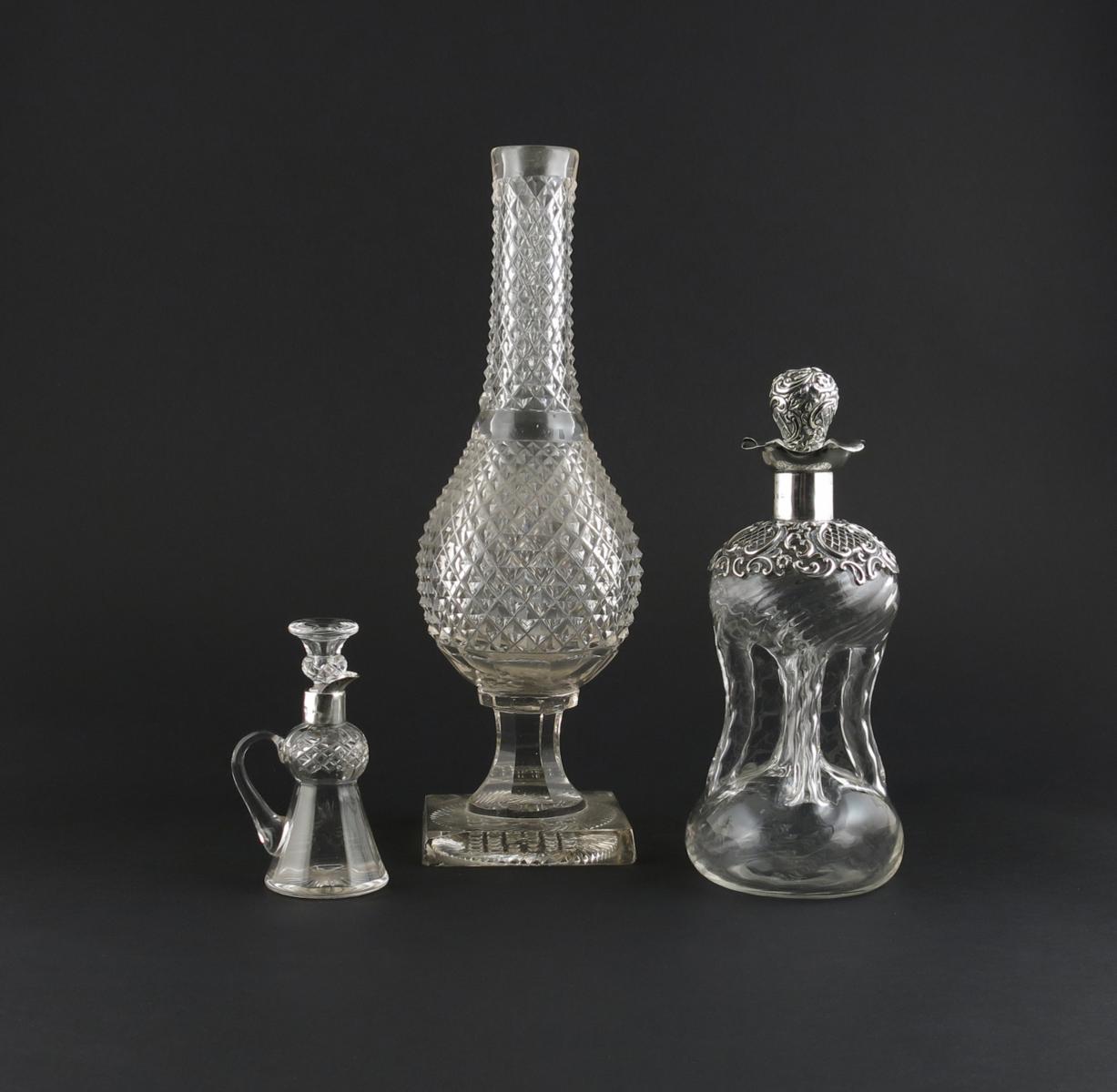A cruciform silver-mounted carafe and stopper, 19th century, with silver pierced panels and C