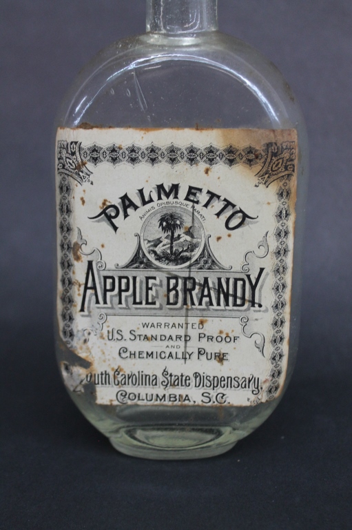Rare South Carolina Dispensary JoJo Flask Bottle circa 1900. bearing original paper label ""