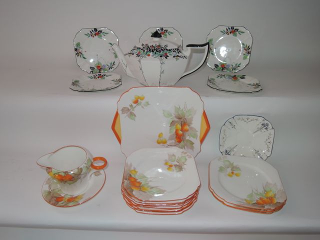 A collection of Shelley Art Deco tea wares with printed and infilled Cape Gooseberry decoration