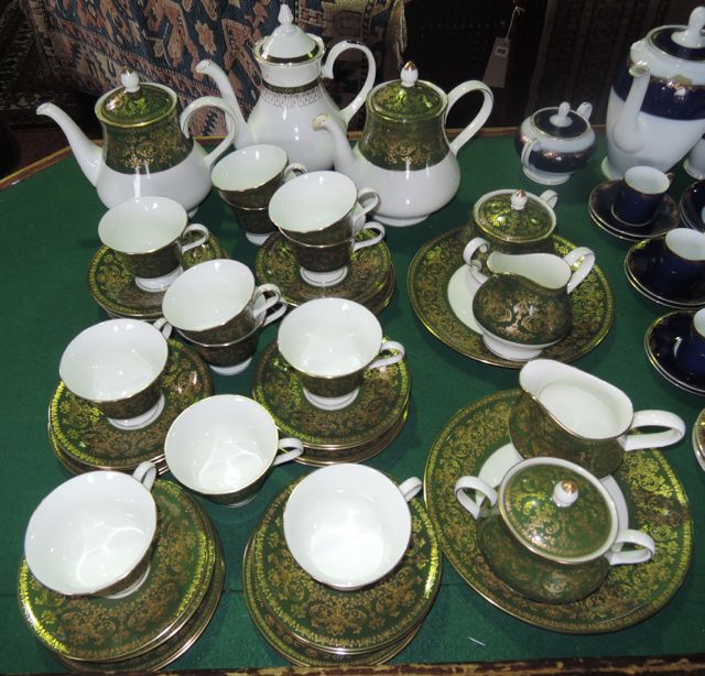 A collection of Wedgwood Harlech pattern green and gilt tea wares comprising two teapots, two