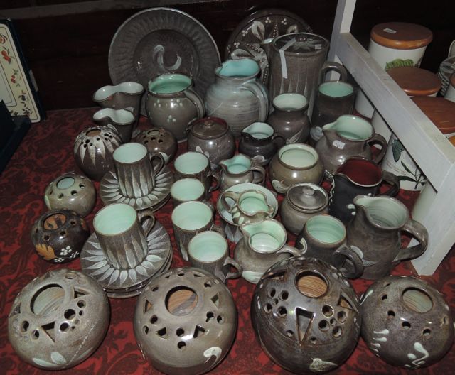 An extensive collection of Fishley Holland Ceramics to include two bowls, coffee pot, various jugs,