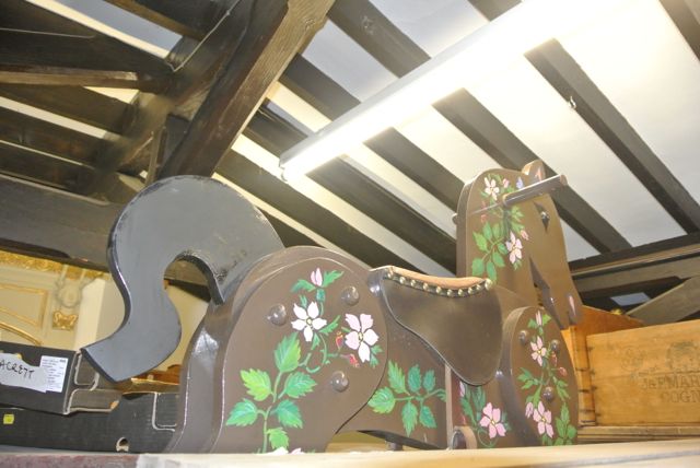 A child`s wooden rocking horse with hand painted floral detail, etc