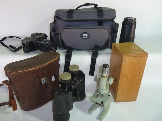 A small Regent travelling microscope and box, a pair of field binoculars, 7 x 50 together with a