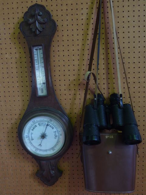 An aneroid barometer with oak case and porcelain dials together with a pair of Yashica binoculars