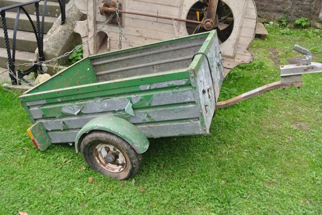 A small car trailer, the galvanised steel body with distressed paintwork, 4ft x 3ft approximately