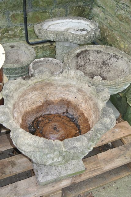 One lot of weathered composition stone to include a small bird bath in the form of a rustic tree