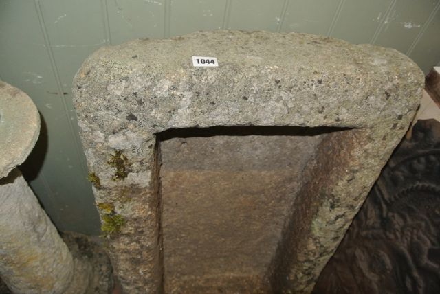 A shallow weathered rough hewn granite garden trough of rectangular form, 84 cm long x 52 cm wide