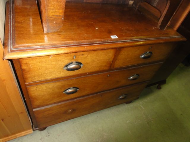 A 19th century mahogany bedroom chest of two long and two short drawers raised on turned column