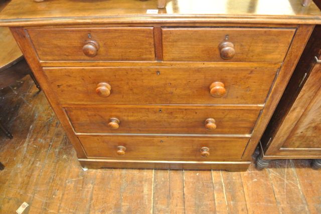A Victorian mahogany chest of three long and two short drawers together with a toilet mirror with