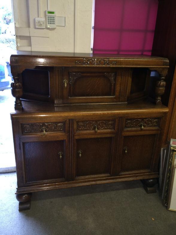 Dark Wood Carved Sideboard Over Three Cupboards With Central Cupboard Over. Measures: 139 Cm Wide x