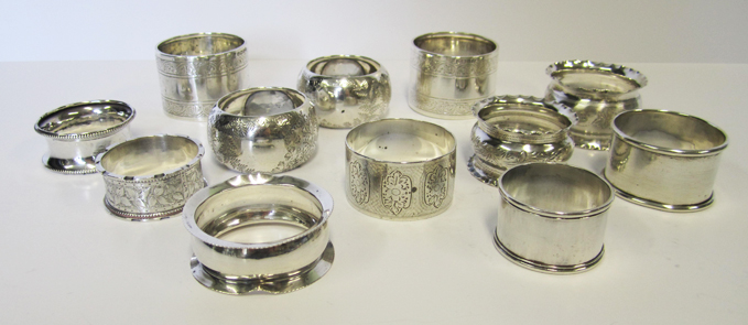 A COLLECTION OF TWELVE SILVER NAPKIN RINGS, VARIOUS MAKERS AND DATES, LONDON, BIRMINGHAM, CHESTER