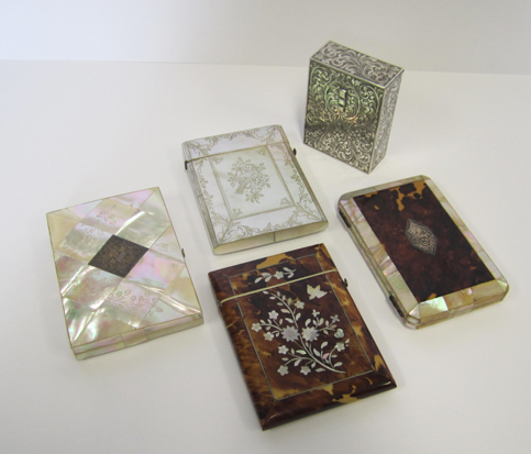 A VICTORIAN TORTOISESHELL AND MOTHER-OF-PEARL INLAID CARD CASE  the rectangular body with hinged