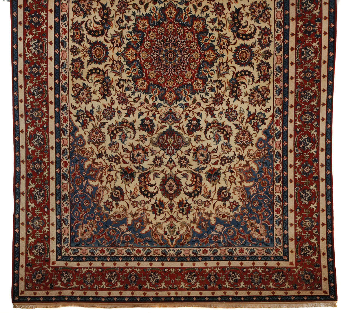 A fine Ispahan carpet Persia, the ivory field with a terracotta floral star medallion, skyblue