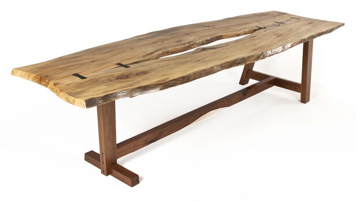 AN EBONY, KIAAT AND YELLOWWOOD TABLE, 20TH CENTURY the natural top joined by ebony butterfly