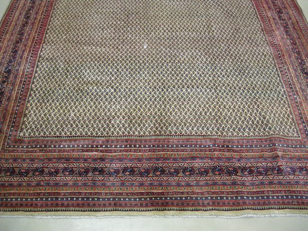 A Sarouk-Mir carpet, Persia, modern the ivory field with an overall pattern of small ?botehs?