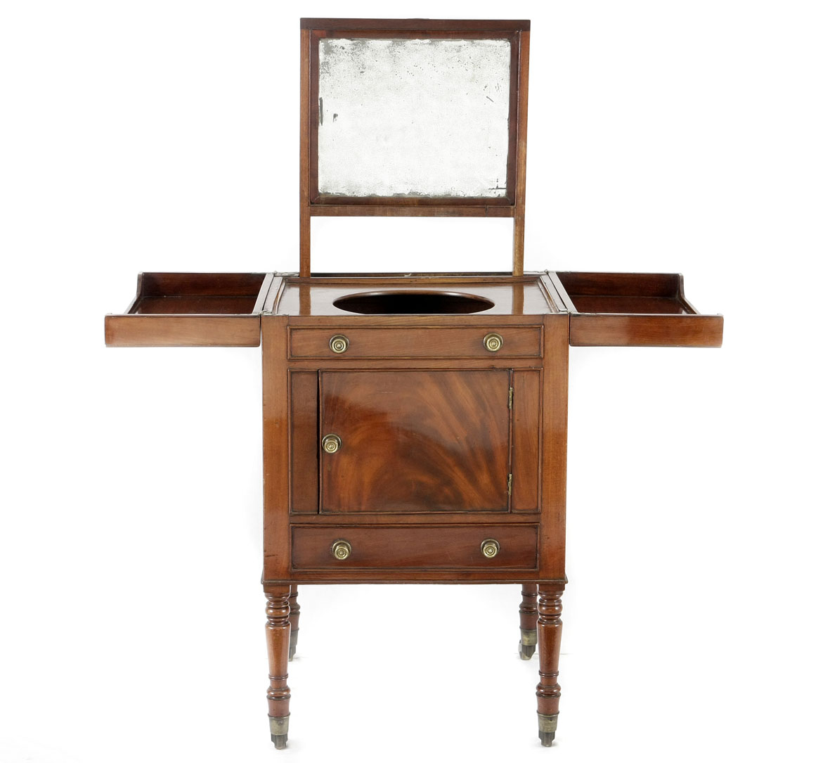 A Georgian mahogany campaign washstand, early 19th century the rectangular hinged top opening to