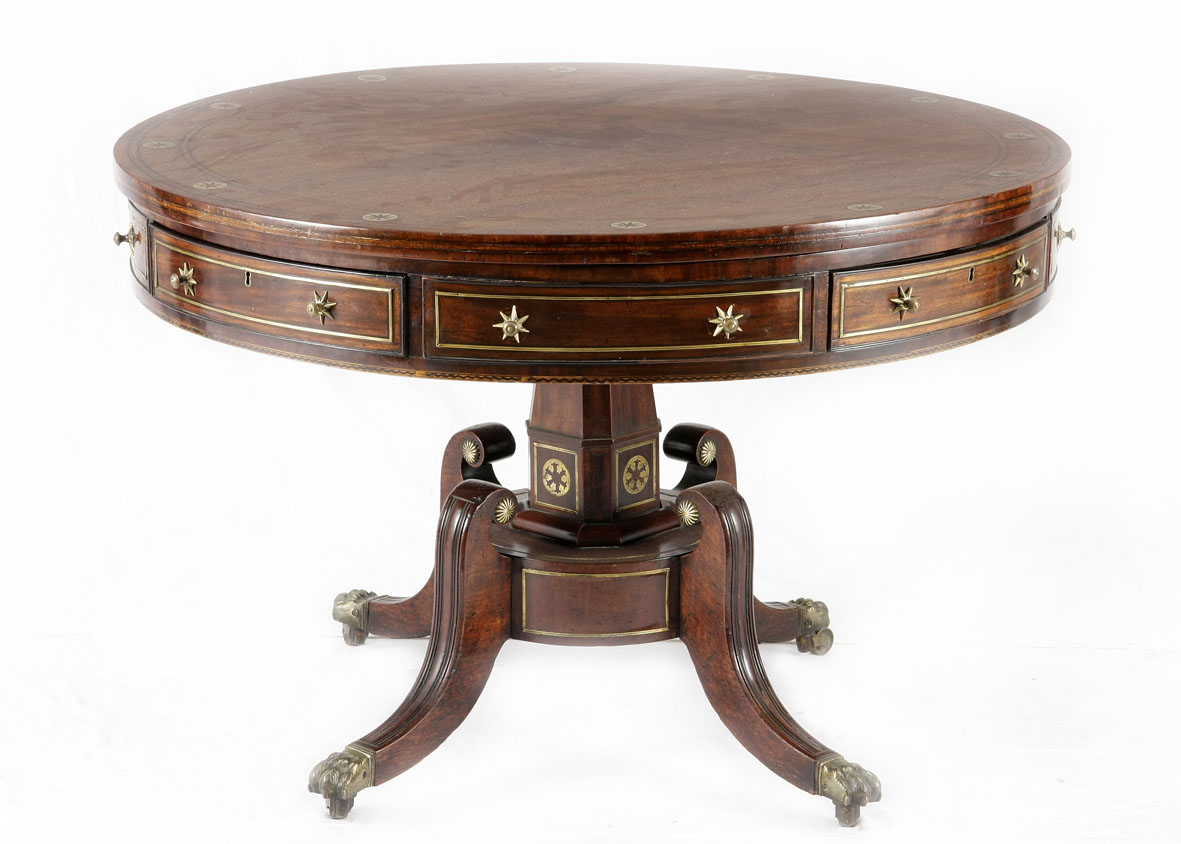 A Regency mahogany and brass-inlaid drum table, first quarter 19th century the circular top inset