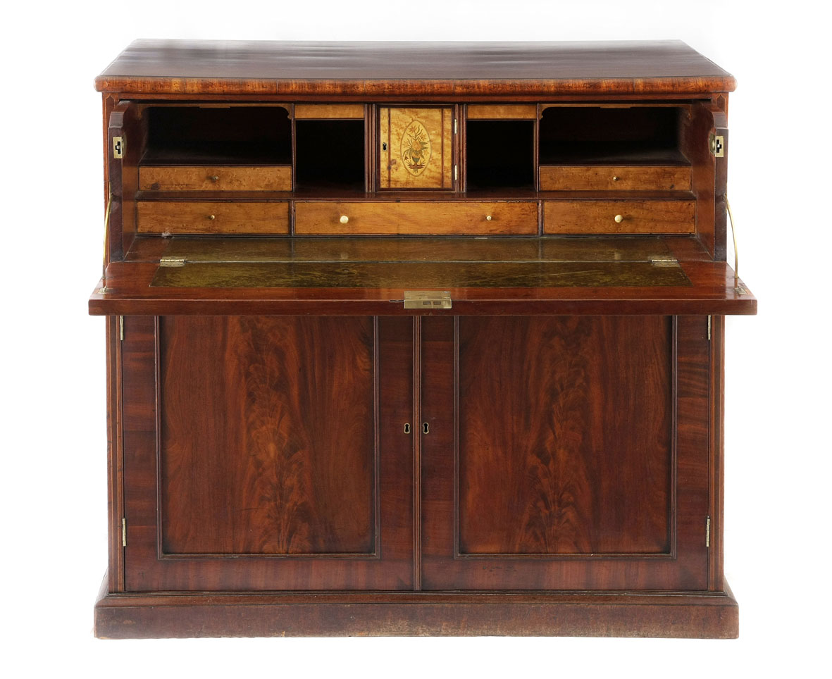 A George III mahogany and inlaid secretaire chest, early 19th century the rectangular top above a