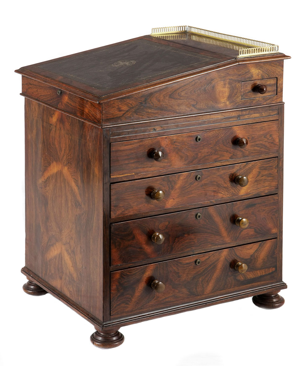 A Regency rosewood Davenport, first half 19th century the rectangular top with a three-quarter