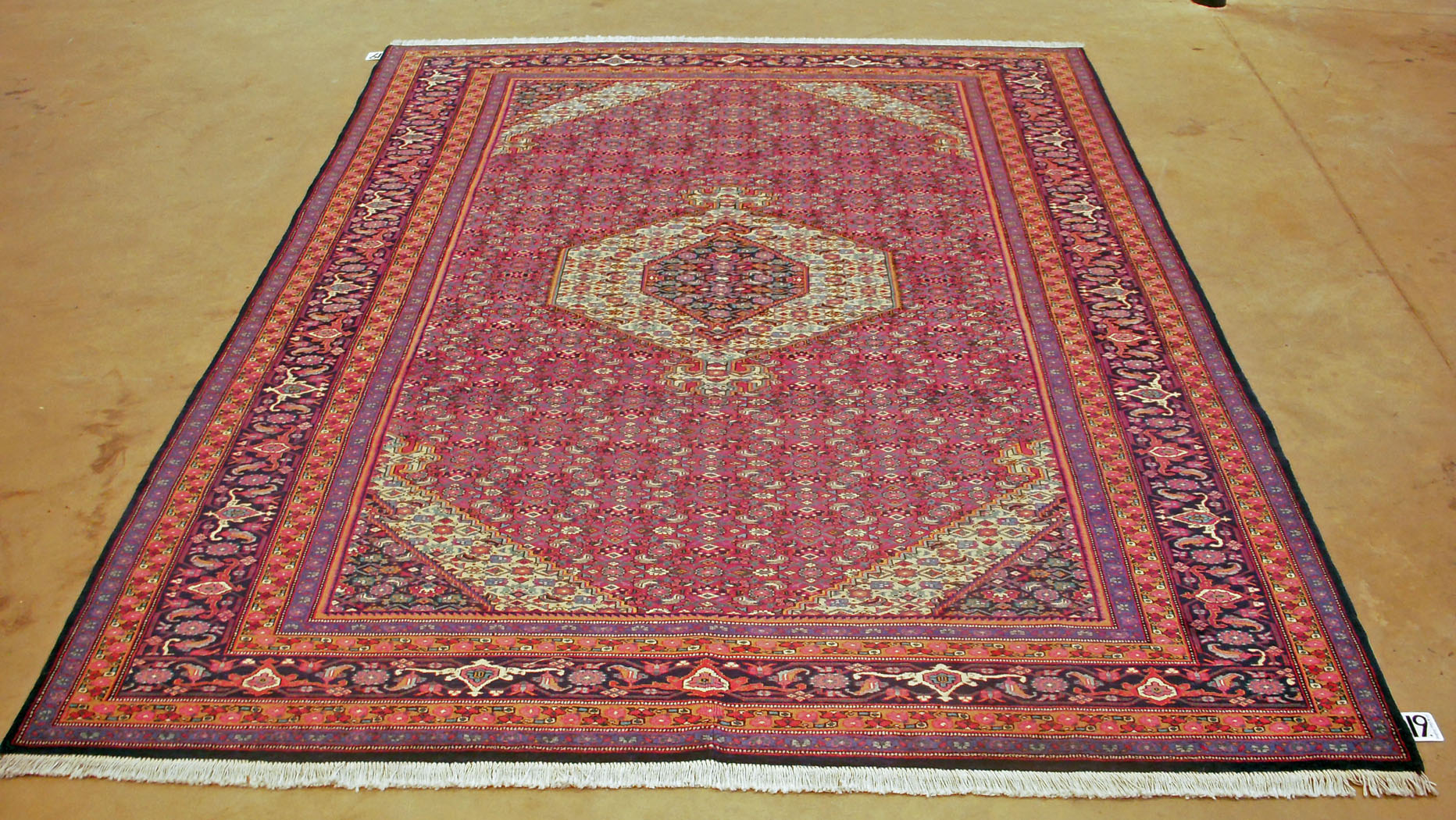 A SENNE-KURD CARPET, PERSIA, MODERN the scarlet-red field with an ivory and indigo blue diamond