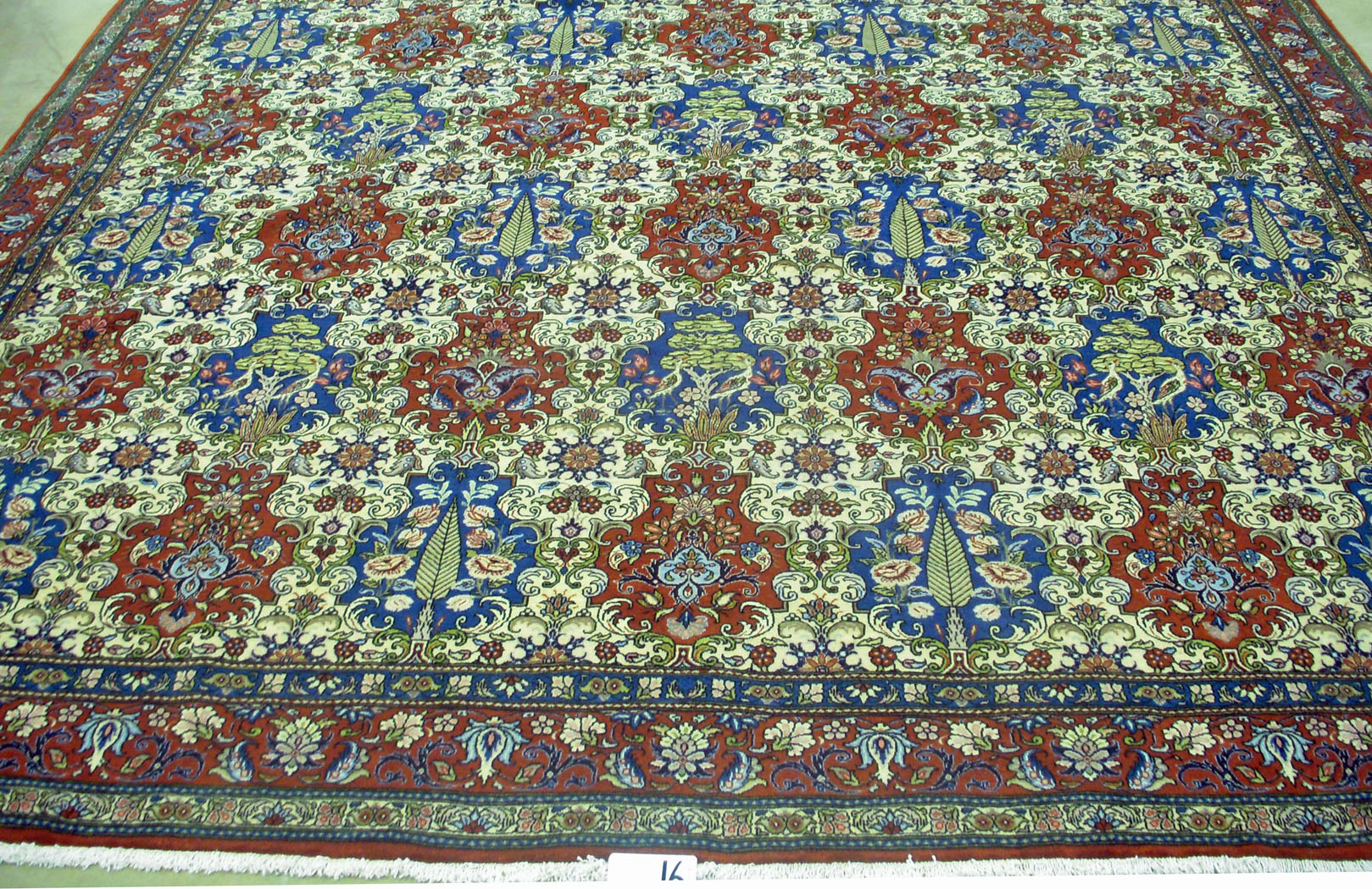 A BAKTIAR CARPET, PERSIA, MODERN  the ivory field with an overall multi-coloured floral cartouche