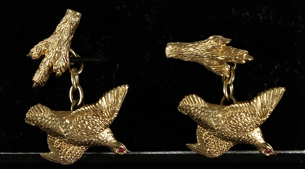 Pair of 9ct gold cufflinks in the form of a grouse and grouse foot, having a ruby inset as the