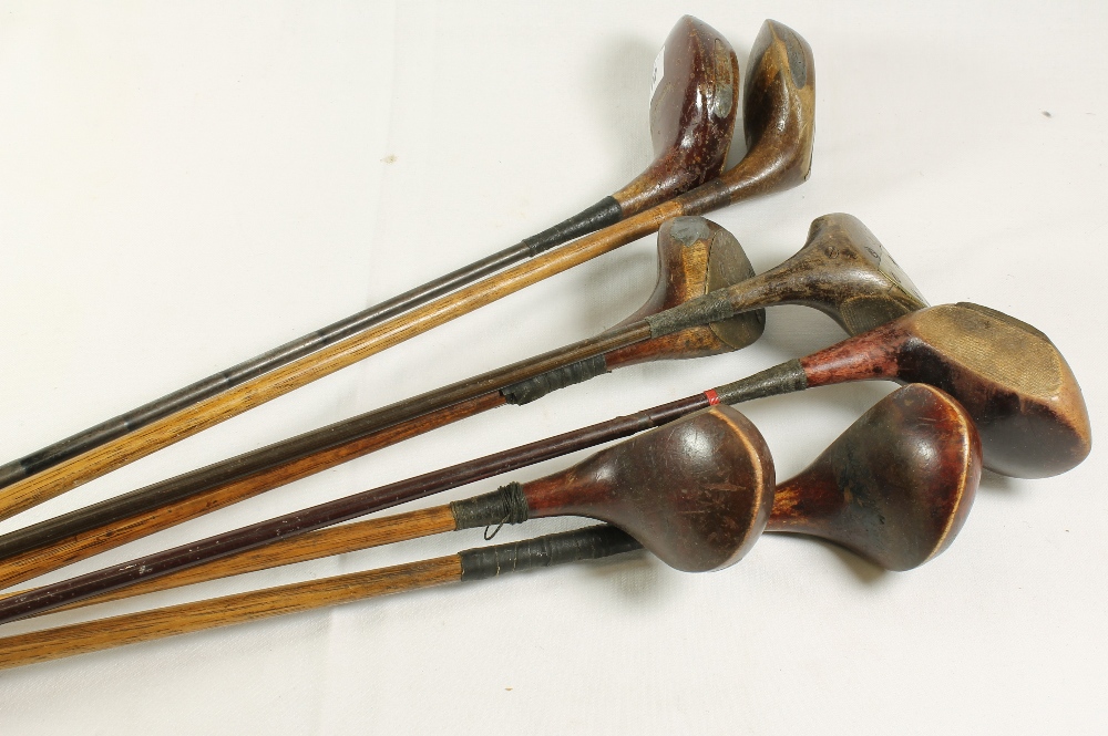 Seven hickory shafted golf clubs including a Gibsons of Kinghorn wood, McAndrews trajectory wood,