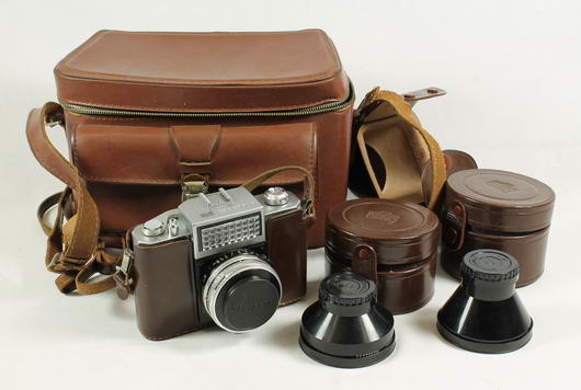 Nikkorex of Japan camera with leather case, two cased Nippon Kogaku lenses and a leather camera bag