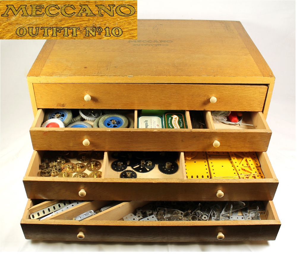 Meccano outfit number 10 contained in a light oak four drawer chest with painted branding to top