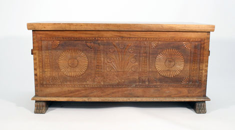 A carved walnut chest of boarded construction, w. 109 cm    CONDITION REPORT:  good, minor split