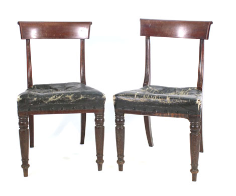 A set of four early Victorian mahogany framed 'bar back' dining chairs on turned tapered legs