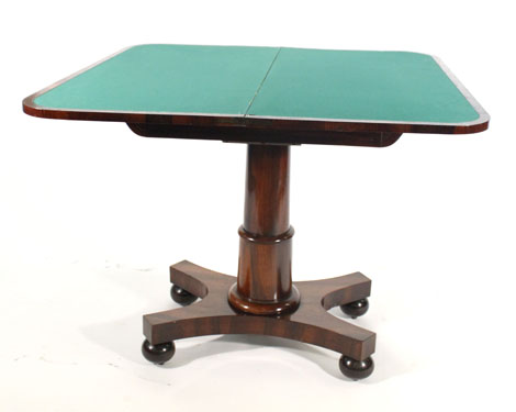 A Regency rosewood card table, the fold over top with rounded corners on a plain support with