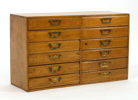 An oak filing chest of twelve short drawers, w. 77 cm   CONDITION REPORT:  Wear commensurate with