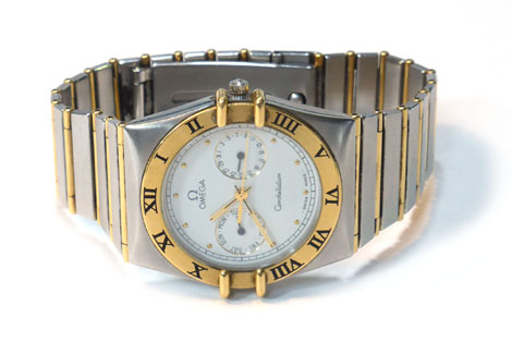 A two-colour stainless steel cased Constellation wristwatch by Omega, the circular white face with