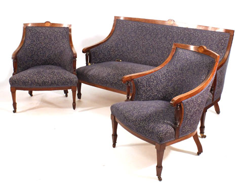 A 19th century stained beech, strung and inlaid parlour suite, the sofa and two armchairs each