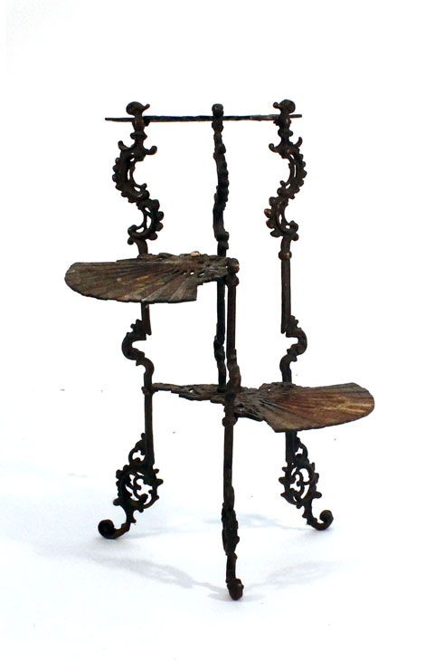 A cast metal three-stage etagere, the plateaux in the form of fans, h. 78 cm   CONDITION REPORT: