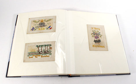 An album containing 29 First World War silk cards and two postcards   CONDITION REPORT:  mostly with