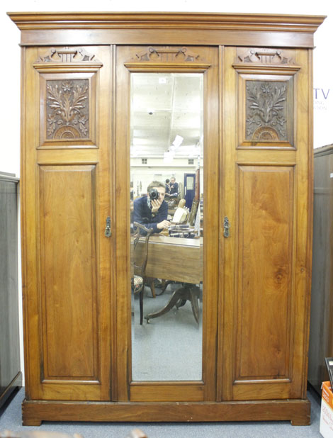 An Edwardian walnut double wardrobe of typical form with a central mirror, w. 147 cm   CONDITION