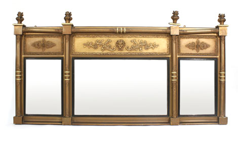 A 19th century rectangular three panelled overmantle mirror in a Neo-Classical style moulded gilt