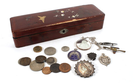 A Japanese lacquer box containing various Victorian coins and medals    CONDITION REPORT:  extensive