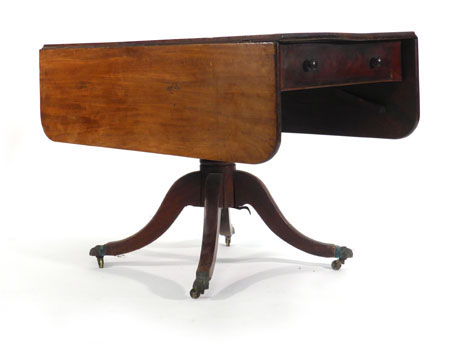 An early 19th century mahogany Pembroke table on a turned support with a quadruple base, l. 112 cm