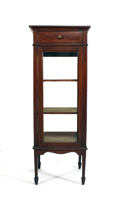 An Edwardian mahogany, strung and glazed display cabinet with one drawer over a single door on